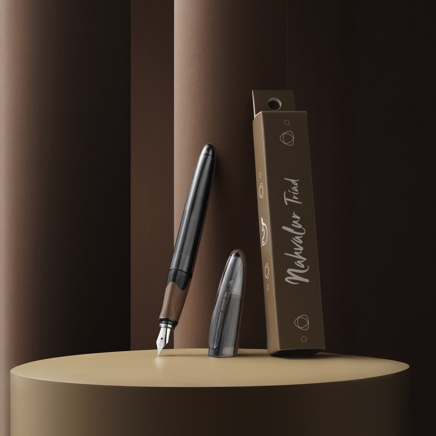 Fountain pen and ink cartridge with packaging on a brown background
