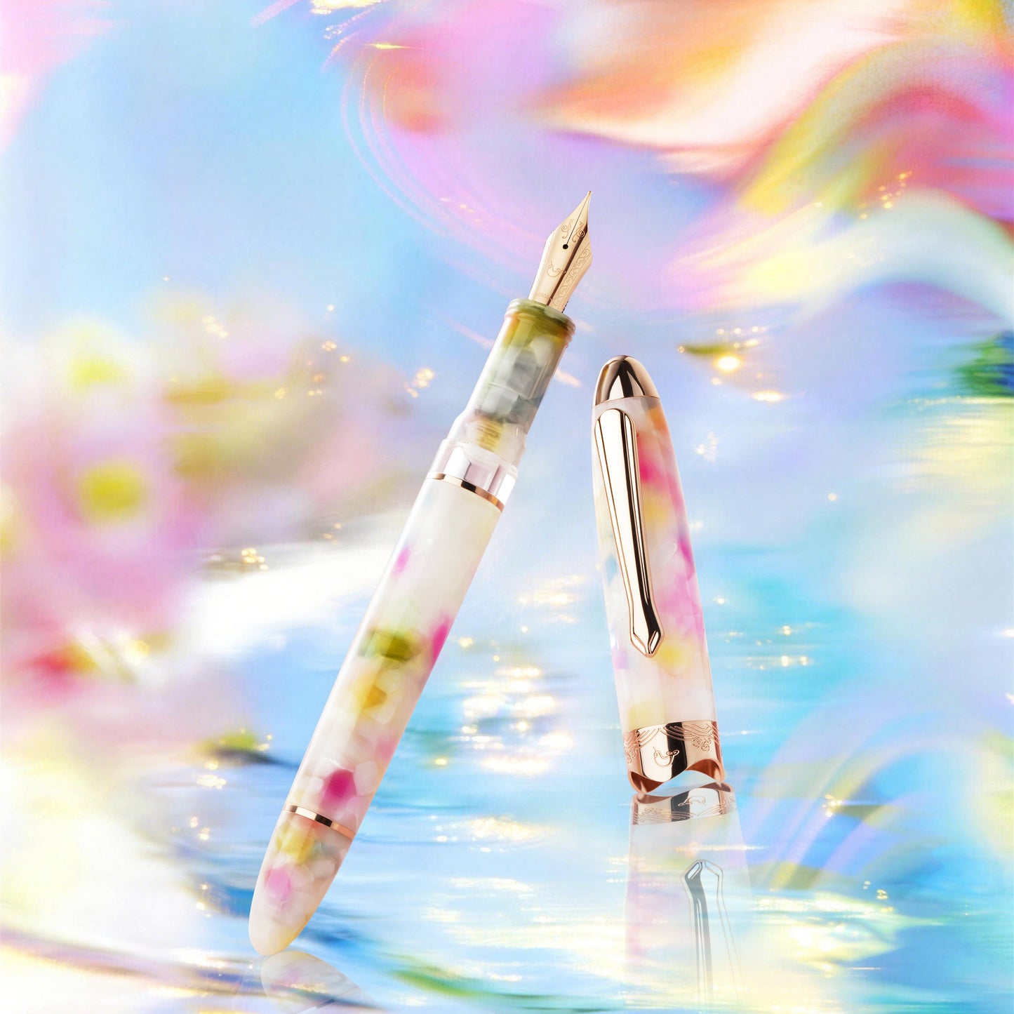 
                  
                    Two pens with floral designs on a colorful, abstract background
                  
                
