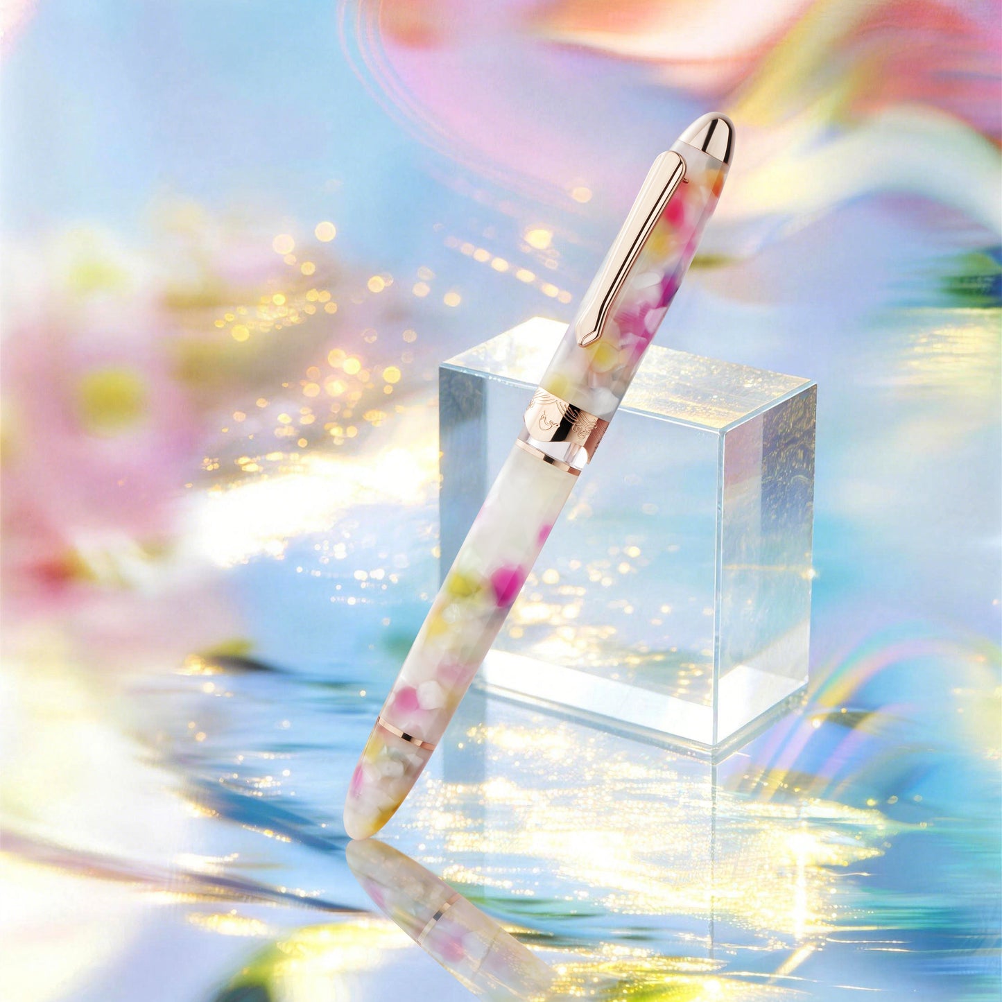 
                  
                    Decorative pen on a clear crystal block with a colorful, abstract background
                  
                