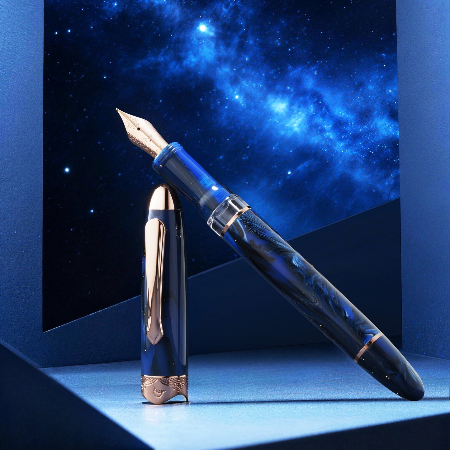 
                  
                    Fountain pen with a blue galaxy-themed background
                  
                