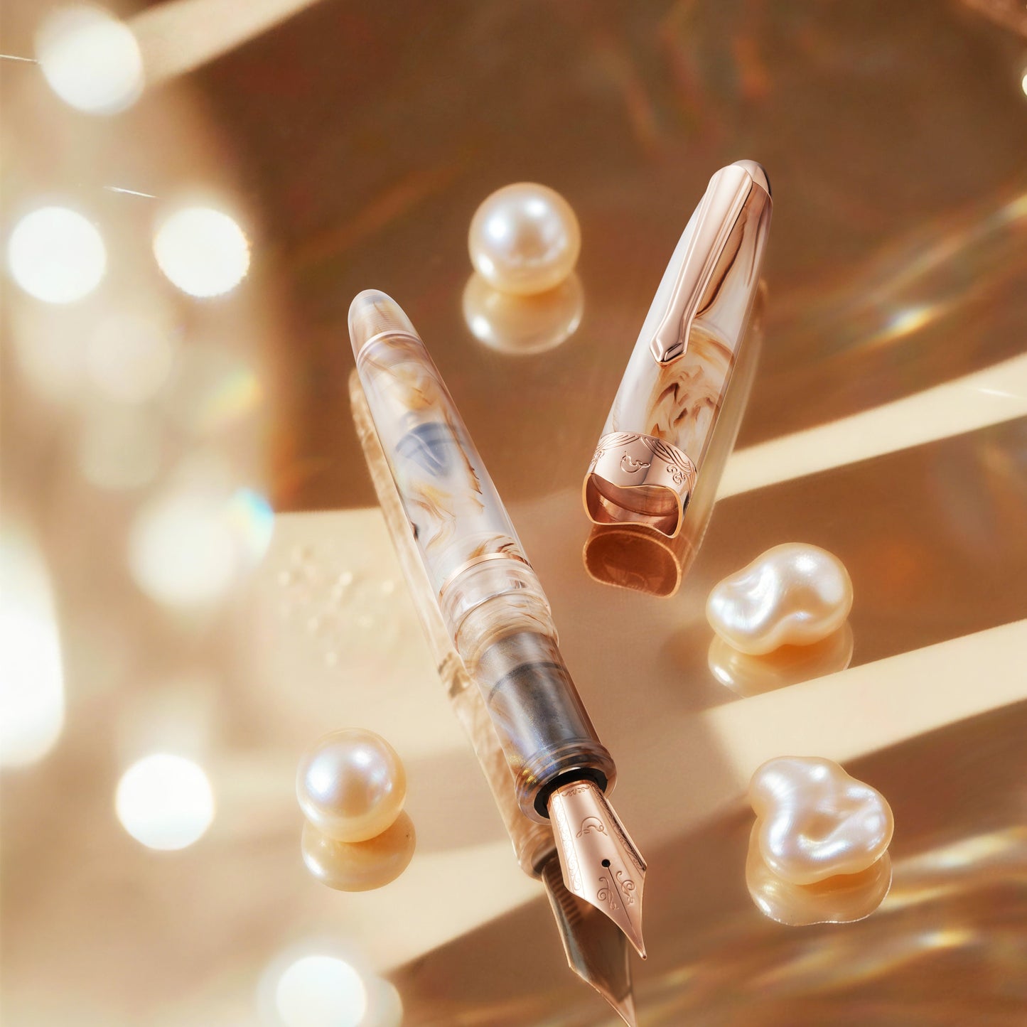 
                  
                    Fountain pen with nib and decorative elements on a reflective surface with pearls.
                  
                