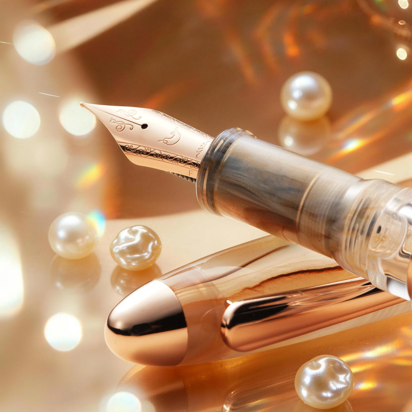 
                  
                    Gold fountain pen with pearls on a reflective surface
                  
                