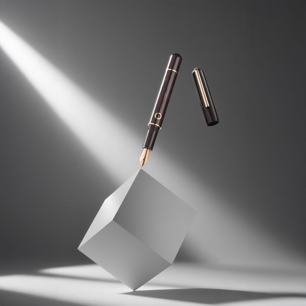 Pen on a white cube with a spotlight effect