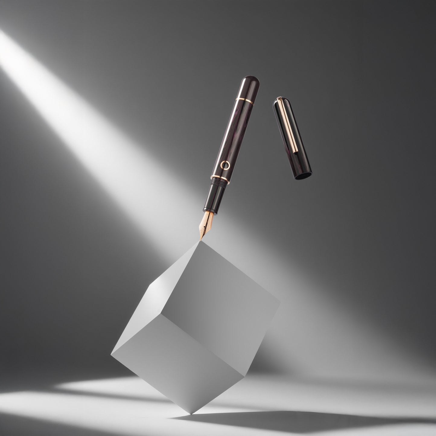 Pen on a white cube with a spotlight effect